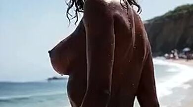POV Paradise: Oiled Ebony Babe's Perfect Ass at the Beach